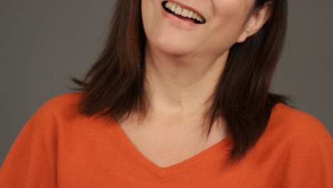 middle aged woman smiling and laughing portrait