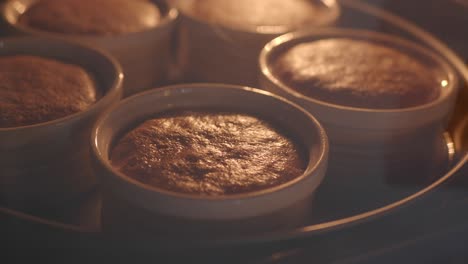 close up of chocolate cakes baking in the oven