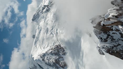 Vertical-4k-Time-Lapse,-Clouds-Moving-Above-Snow-Capped-Mont-Blanc,-French-Alps-on-Sunny-Day