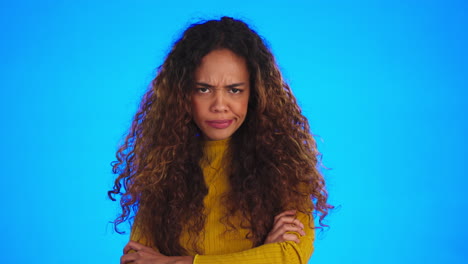 face, angry and woman with arms crossed in studio