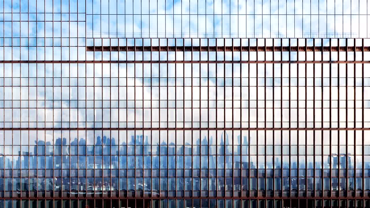 Time lapse moving clouds reflected facade building.