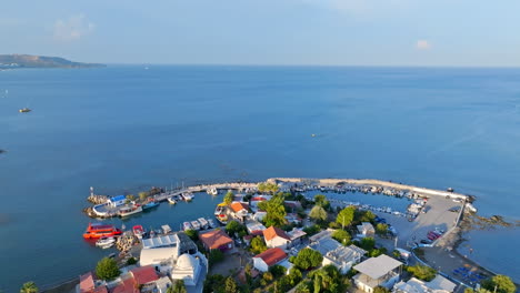 aerial view tilting over the faliraki harbor, golden hour in rhodes, greece