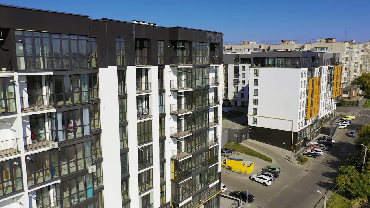 Modern residental apartments exterior. Drone view of new building townhouses.