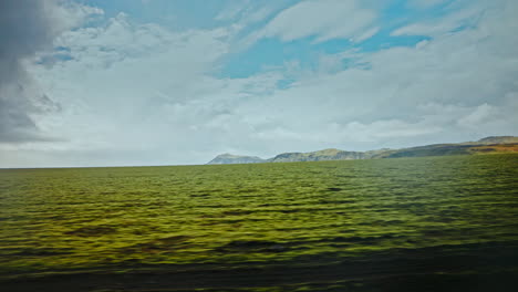 driving through the volcanic landscape of iceland