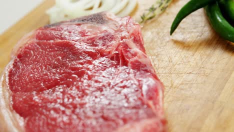 Raw-steak-and-ingredients-on-chopping-board