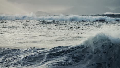 massive waves roll into the coast of hawaii in slow motion