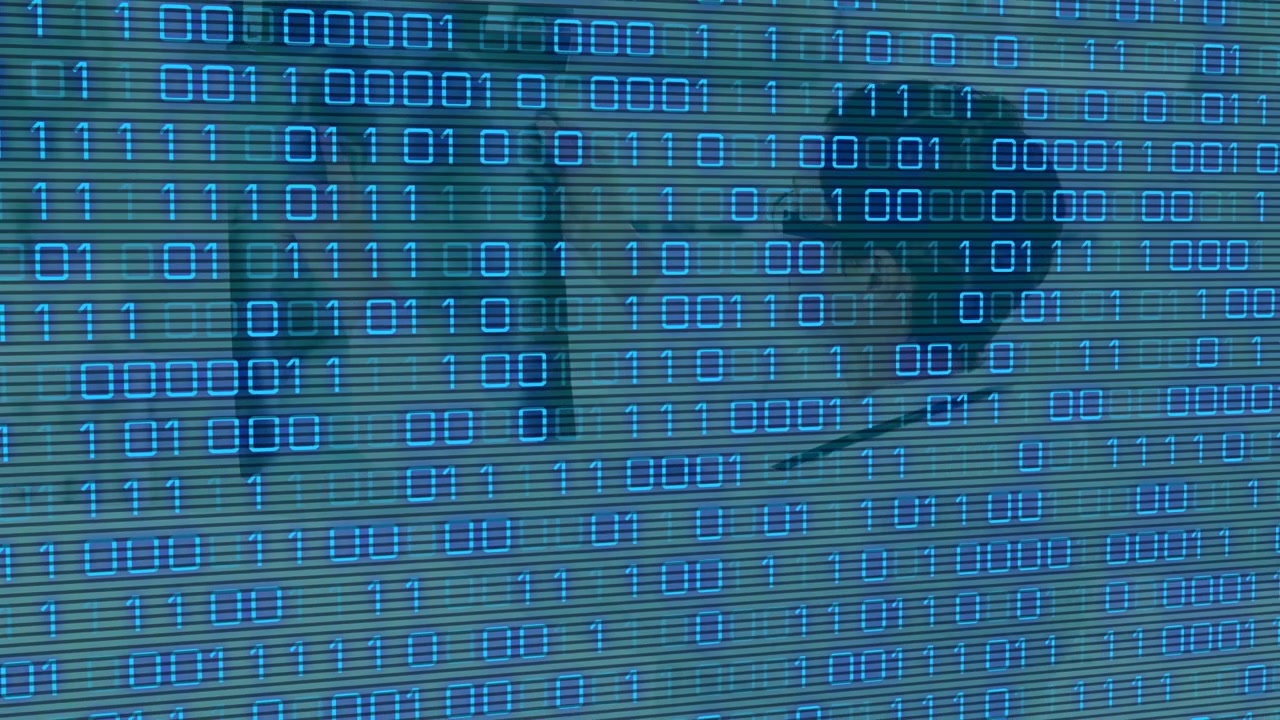 Digitalt genereret billede af blå lysspor mod en rød teknologibaggrund