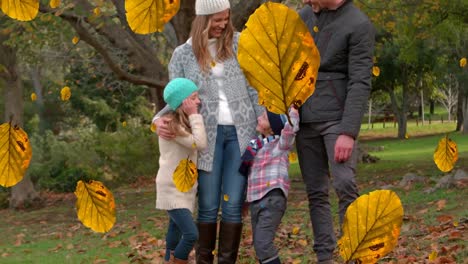 Animation-of-fall-leaves-falling-over-happy-caucasian-family-in-autumn-park