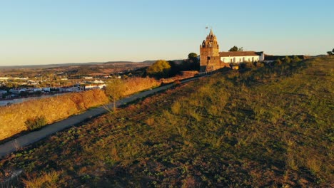 drone shot of a medieval tower on a hill in portugal