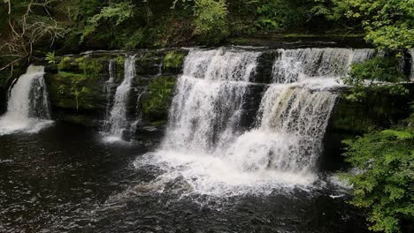 gushing waterfall in slow motion at brecon beacons national park in uk