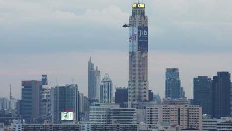 sikorsky uh-60 black hawk helicopters fly over the city of bangkok, thailand