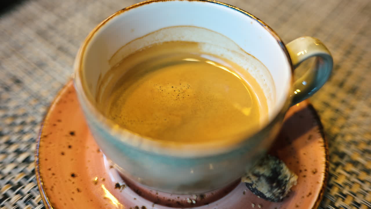 Cup of coffee in a ceramic mug in a rustic environment
