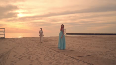 love couple walking towards each other. romantic evening on beach