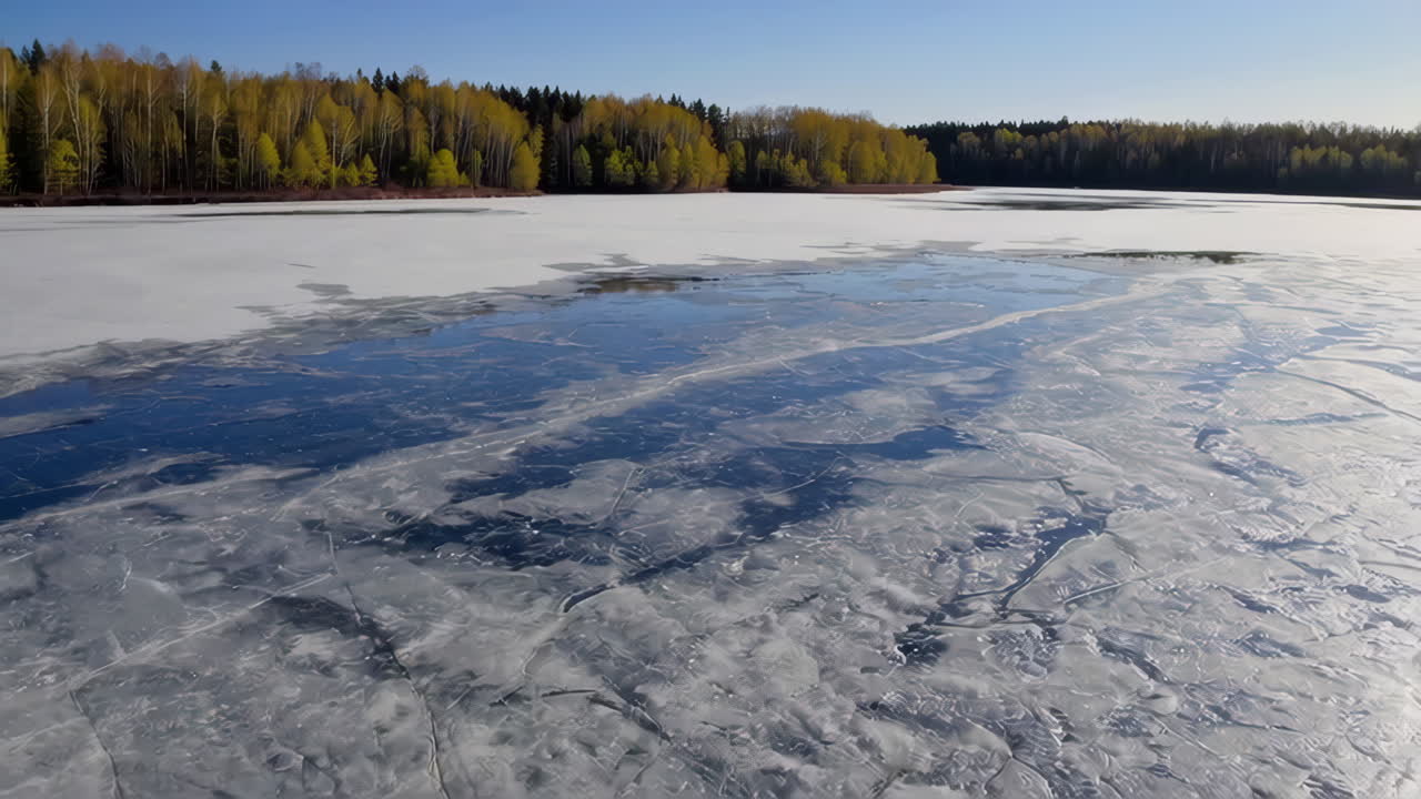 Frozen Lake in Spring with Melting Ice and Forest