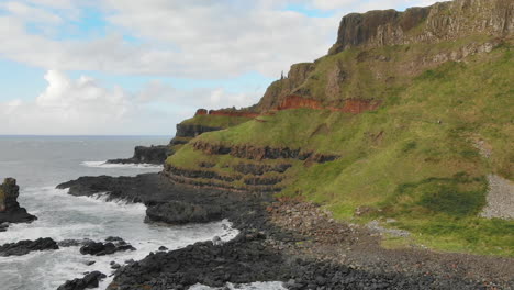 Aerial-pull-out-shot-of-Northern-Ireland's-coastline