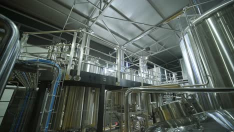 modern craft brewery. craft beer production. modern equipment in brewery, metal tanks, alcoholic drink production