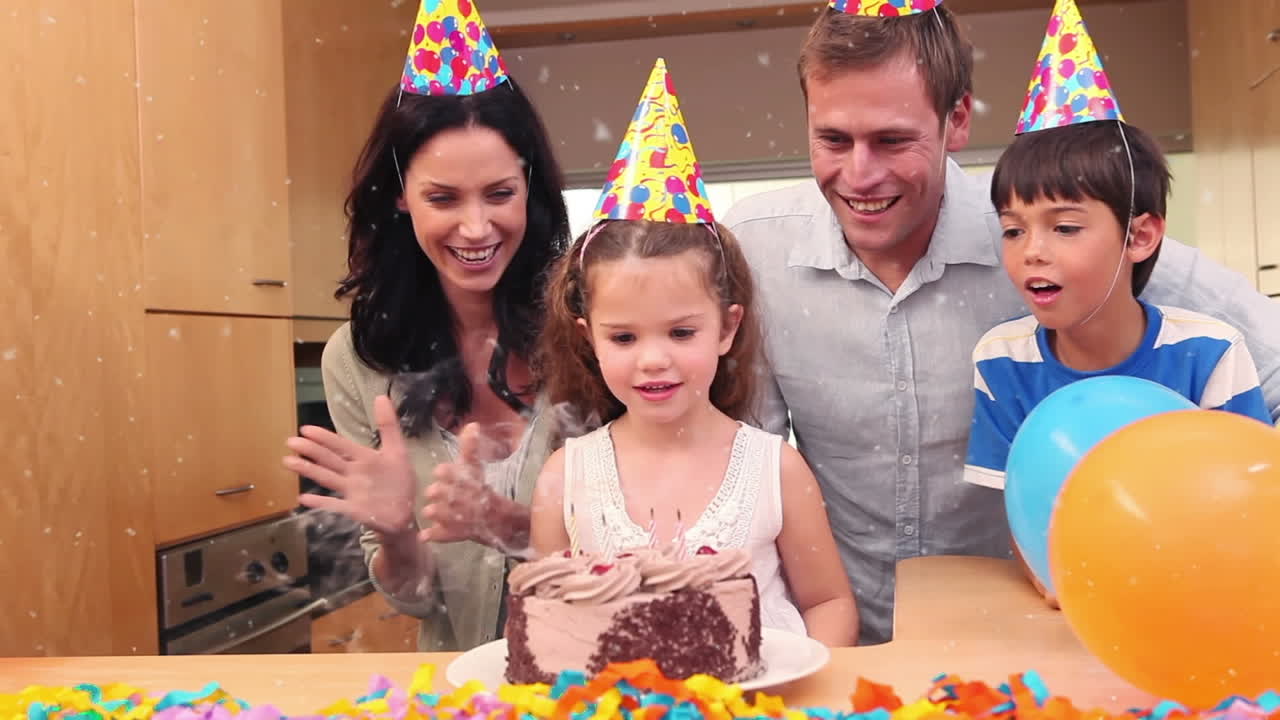 animación de puntos blancos sobre una familia feliz en una fiesta de cumpleaños
