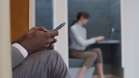 businesspeople using gadgets in office