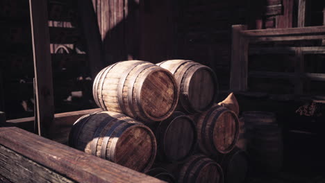 vintage wooden barrels stacked in a rustic setting