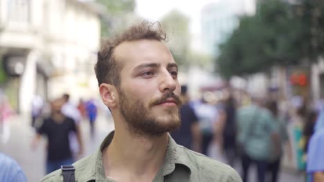 man walking on crowded street.