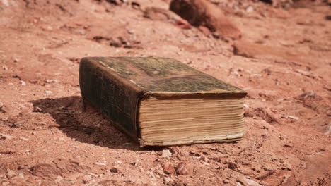 old book in red rock desert