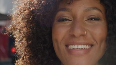 portrait happy african american woman smiling in city