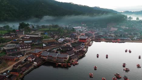 village landscape, chinese boats sailing thailand's river valley, aerial view at ban rak thai, tea plantation lush green hills