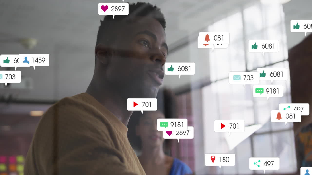 Animation of social media notifications over african american colleagues discussing at casual office