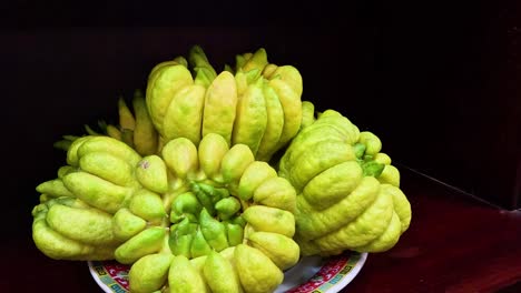 buddha's hand fruit arranged on a plate