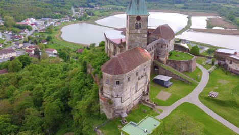 Güssing-Castle-in-Burgenland,-Austria-with-Beautiful-Lakes-and-Greenery-in-the-Background-on-a-Summer-Day