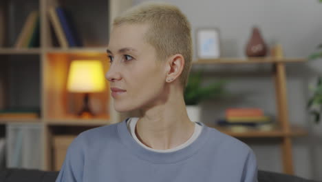 woman with short hair in a living room