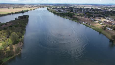 motorboats speeding and leaving wake on clarence river during racing event in grafton, nsw, australia