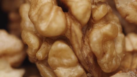 smooth camera movement over a handful walnuts.