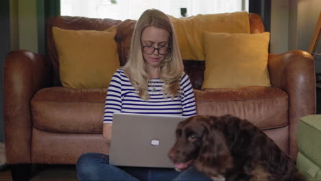 woman working on laptop with dogs