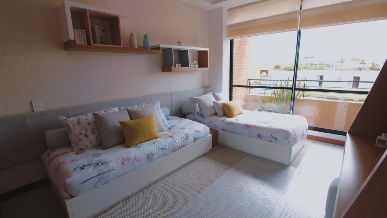 View of the kids' rooms exudes ample light and organization, offering a glimpse into a well-designed and cheerful space