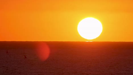 the final rays of sunlight bathe the european skyline in a warm, golden glow, casting long shadows and painting the sky with hues of red, orange, and pink in this stunning