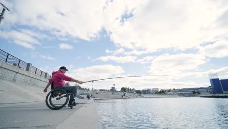 person with a physical disability who uses wheelchair fishing from fishing pier