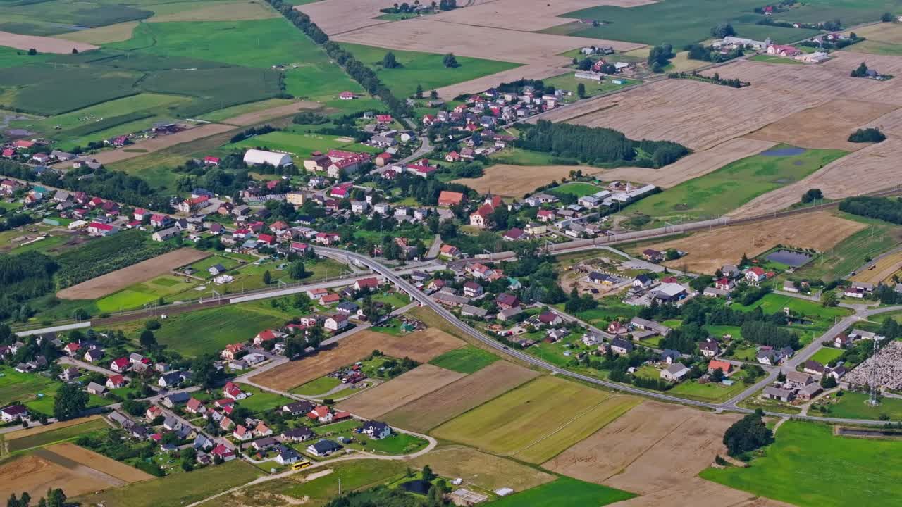 Cinematic establishing Zabrowo Poland village landscape with fields and greenery