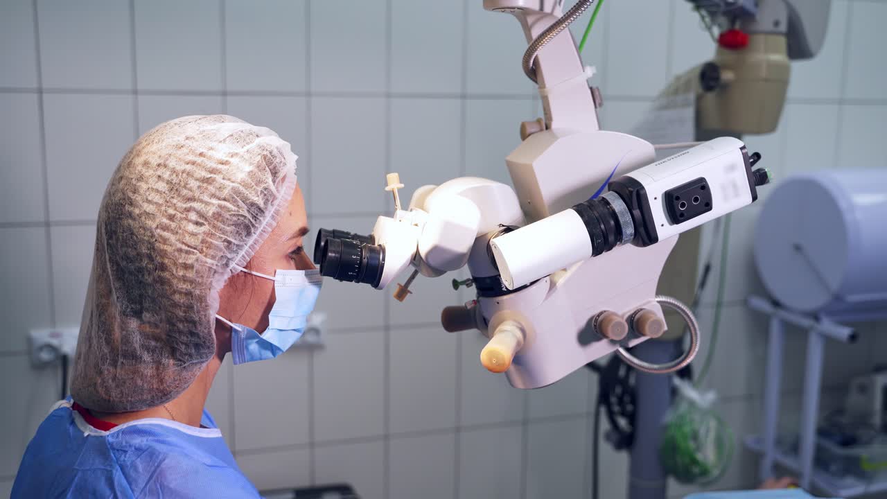 Surgeon performing operation on eyes. Surgeon performing laser eye vision correction
