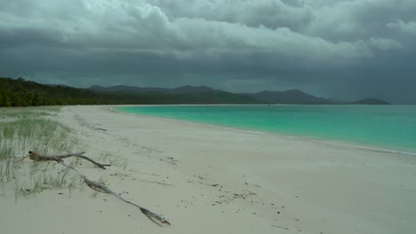 whitehaven beach whitsundays island rain thunderstorm cloudy aerial drone airlie national park australia aus qld outer great barrier reef clear blue turquoise ocean shore holiday vacation static