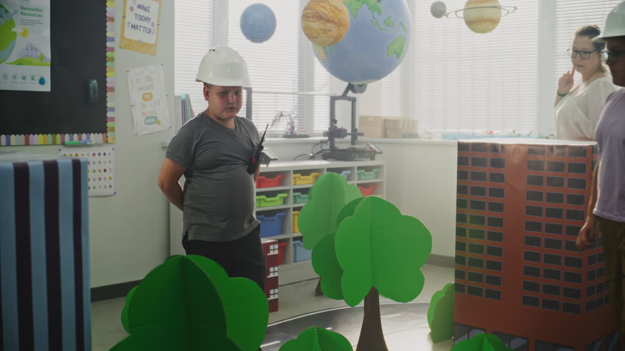 Team of Primary School Students in Hardhats Creating City Planning