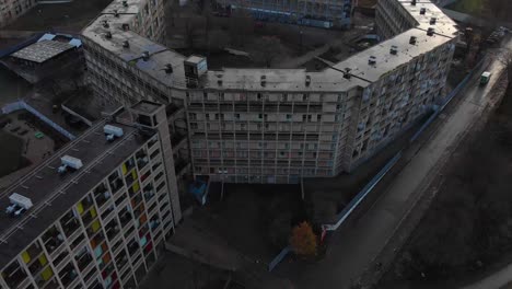 drone shot above the city of sheffield, panning over the abandoned flats of park hill and more