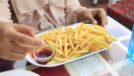 detail shot of french fries on table