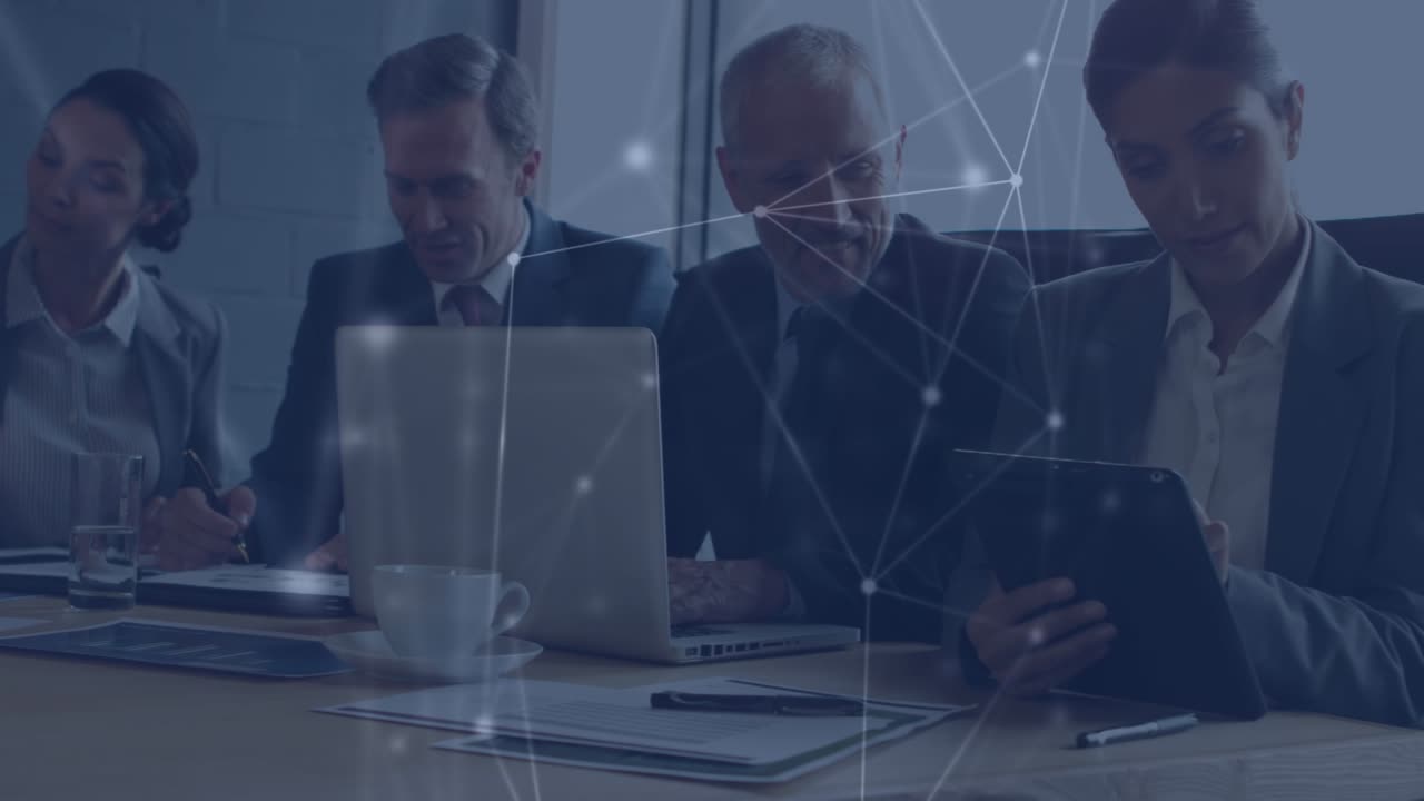 Animation of connections over caucasian businesspeople talking and working