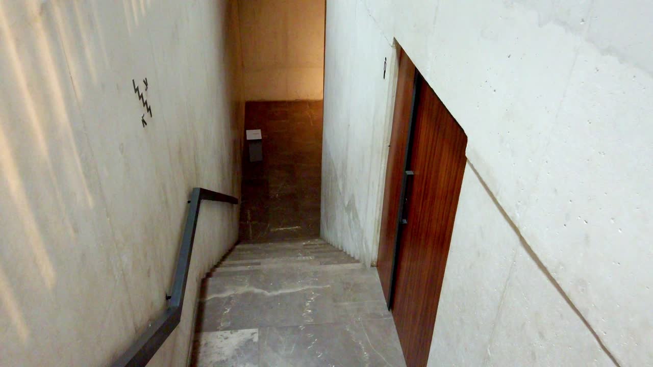 Zoom in shot of concrete staircase descending inside the Modern Art Museum Cuernavaca, Mexico