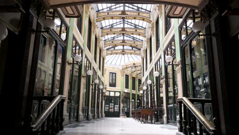 pasaje gutierrez in valladolid, a stunning 19th-century covered gallery with a glass roof that showcases unique architecture and shops, blending history and modern commerce