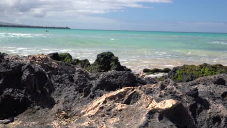 Waves-crashing-over-lava-rocks-at-Hapuna-Beach-on-the-Big-Island-of-Hawai'i