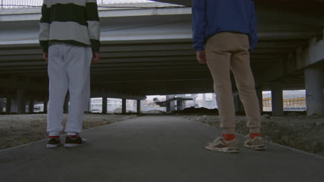 two athletes practicing parkour side flips