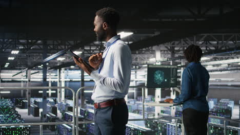 software developers on data center industrial platform analyzing performance
