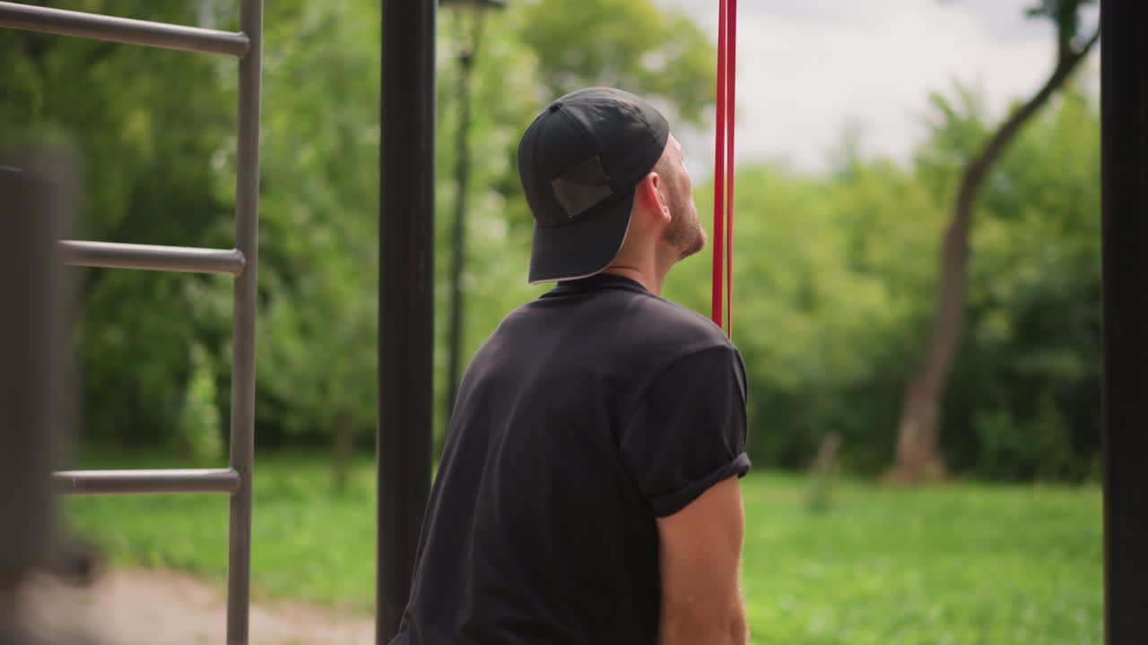 Man Prepares To Climb, Person In Park Prepares For Vertical Exercise, Calisthenics Enthusiast Readies For Upward Movement And Ascent, Man In Park Gears Up For Challenging Climb And Physical Ascent